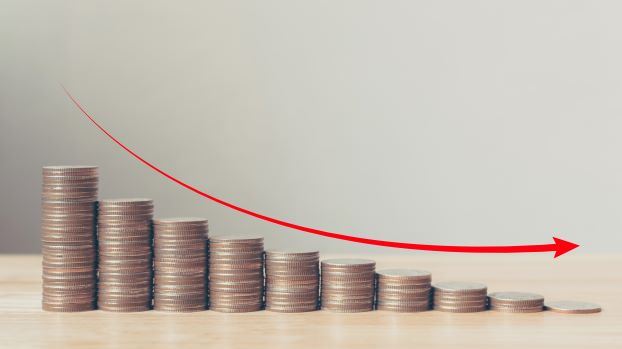 Piles of coins decreasing in size from left to right