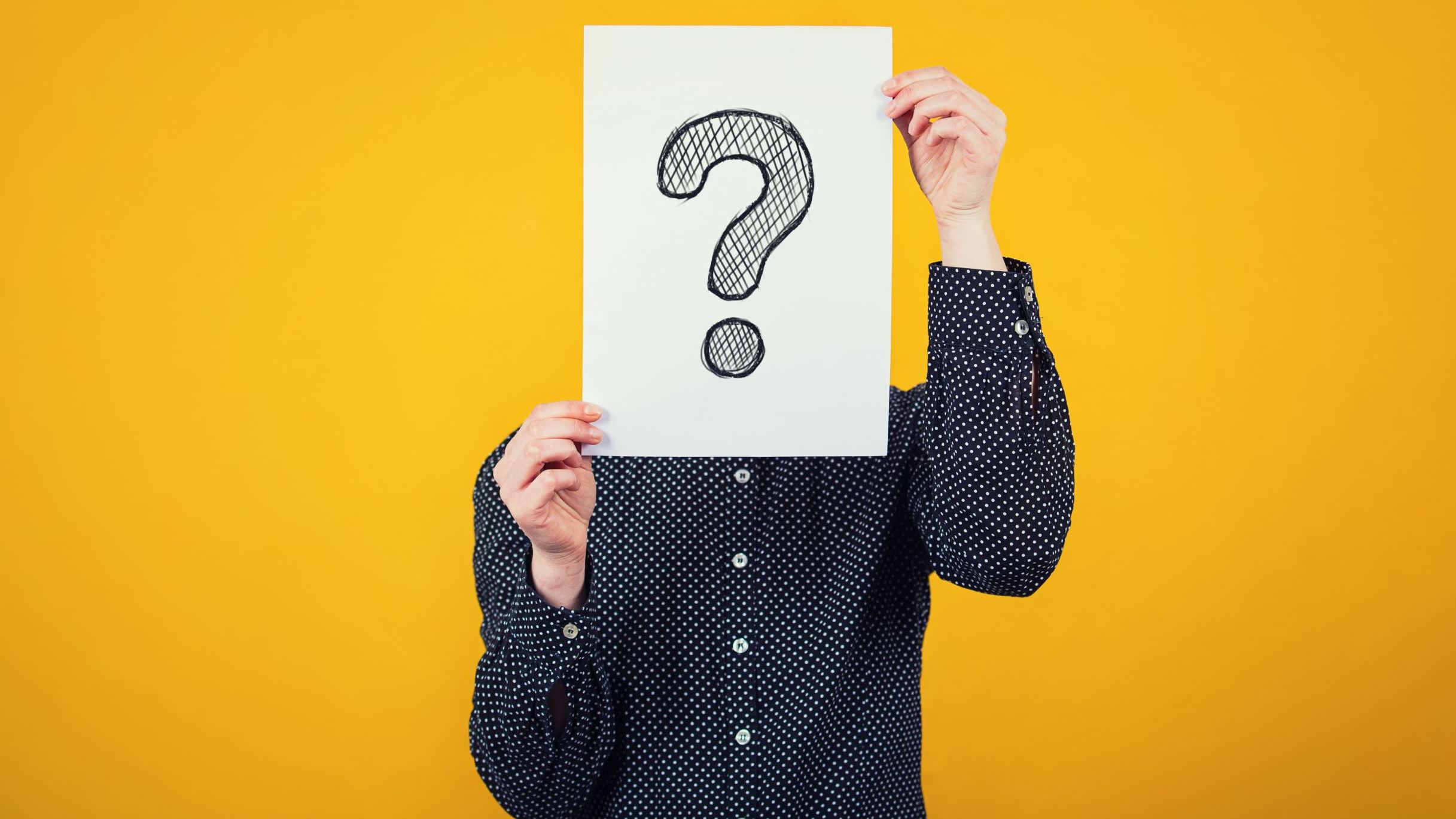 Image showing a man holding a question mark