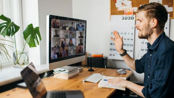 Man working from home on a video call with colleagues