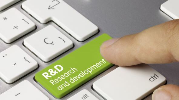 Image of a green 'R&D' key on a keyboard