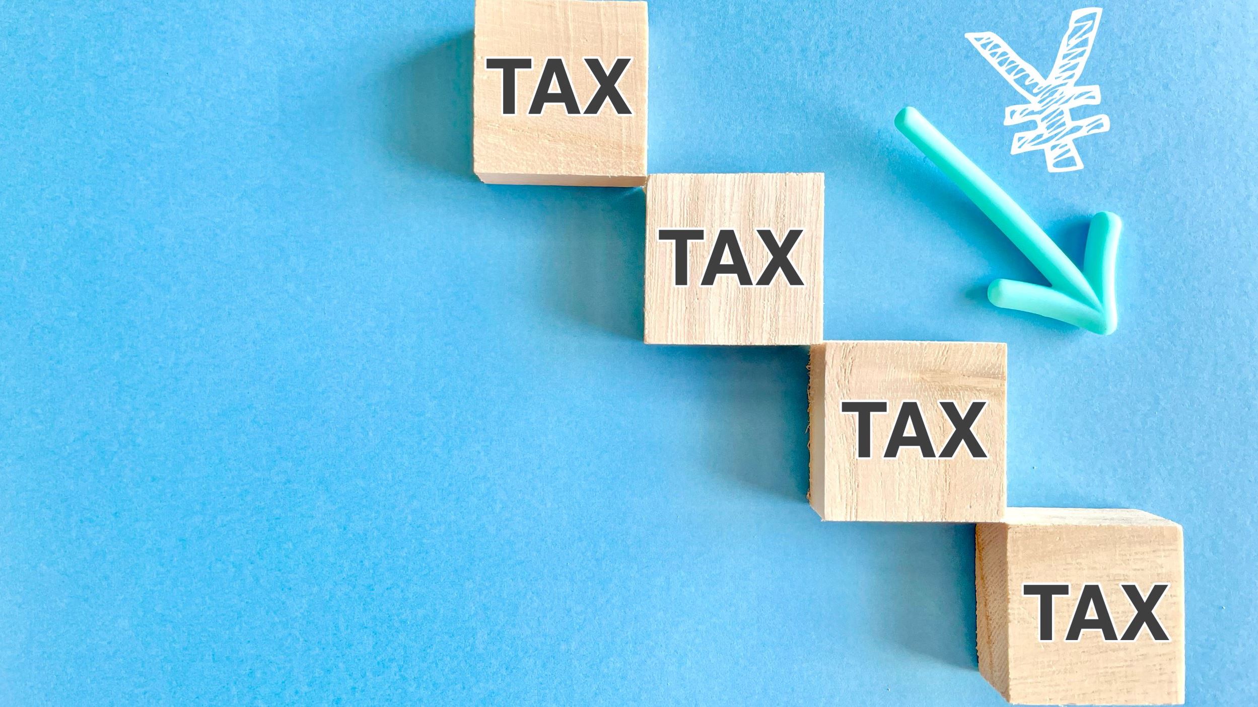 Image showing tax written three times on wooden blocks