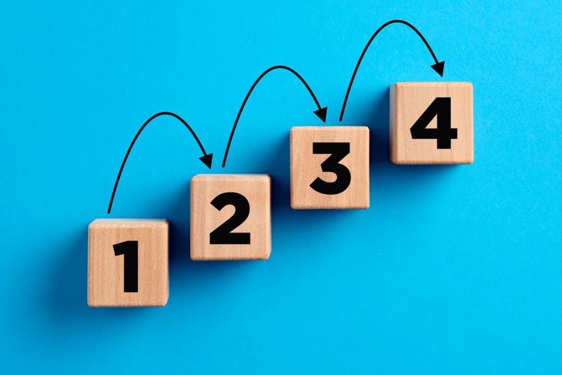 Step By Step Numbers With Arrows On Wooden Cubes