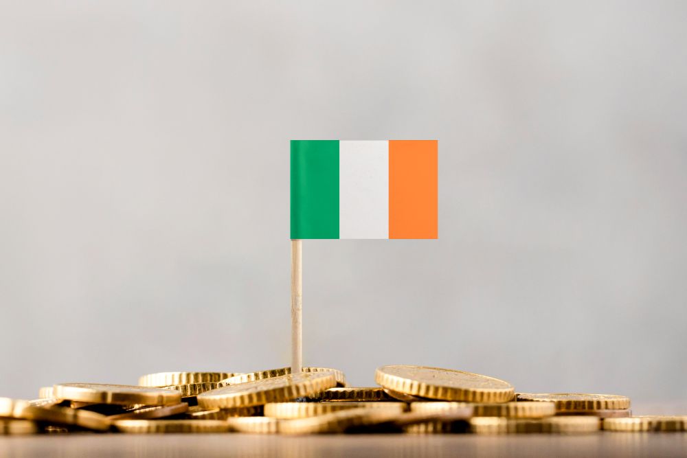 Irish Flag Stuck In Pile Of Coins